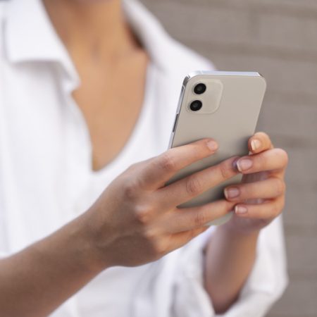 close-up-woman-holding-phone